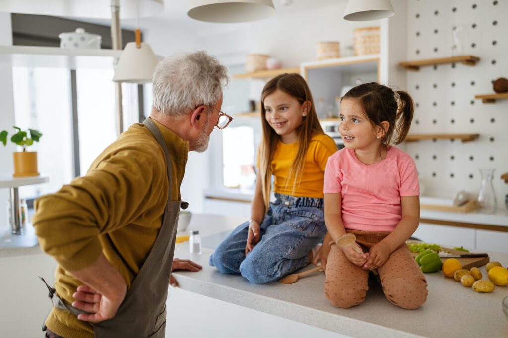 Happy grandparent having fun times with kid at home